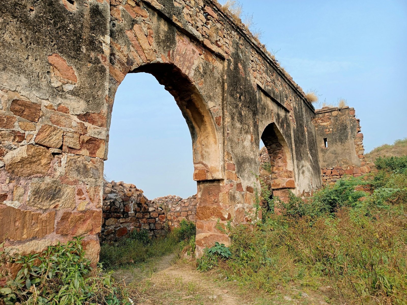 an old stone building with an arched doorway